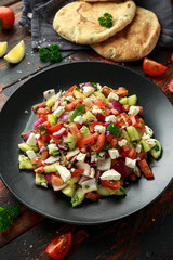 Turkish Shepards Salad with cucumber, tomato, red onion, pepper, parsley pita bread and Feta cheese