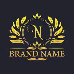 Golden ornamental alphabet N letter logo design. Luxurious golden elegant letter N logo design template.