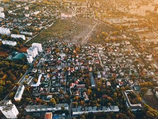 Naklejka premium Amazing view from drone above green beautiful city at sunset