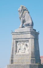 Fototapeta na wymiar Bavarian Lion ( Bayerischer Löwe ) at entrance of the harbor in Lindau, Germany