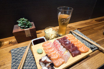 close up view of a delicious plate of fresh sashimi in a sushi bar