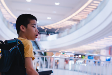 Disabled child on wheelchair having fun shopping about the upcoming New Year's festival in, Special children's lifestyle,Life in the education age of special need kids,Happy disability kid concept.