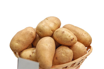 New potatoes are in a basket on the counter of the farmers ' market. The latest hybrid varieties of potatoes.