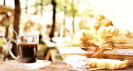 Fresh pastries on the table. French flavored croissant and coffee.