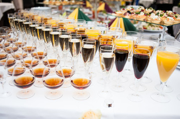 Glasses of different alcohol on the buffet table
