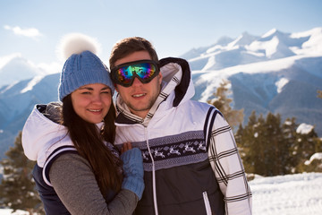 Young people take a rest after skiing in the mountains, winter time.