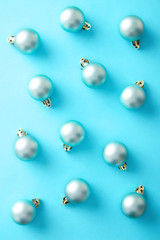 Christmas ornaments pattern on a blue background viewed from above. Top view