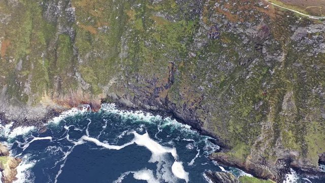 Aerial of Slieve League Cliffs are among the highest sea cliffs in Europe rising 1972 feet or 601 meters above the Atlantic Ocean - County Donegal, Ireland
