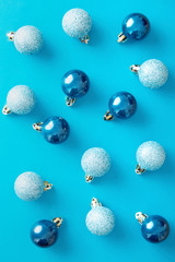 Christmas ornaments pattern on a blue background viewed from above. Top view
