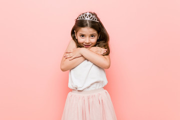 Little girl wearing a princess look going cold due to low temperature or a sickness. © Asier