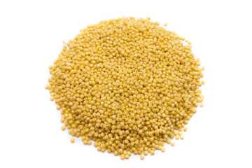 Heap of millet grains isolated on white background