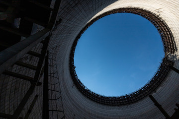 Ladder leading up to ring of blue sky 