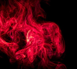 Red smoke on black background