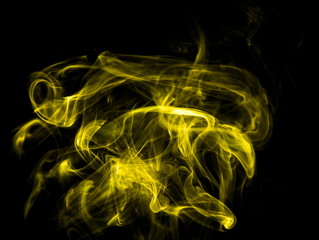 Yellow smoke on black background