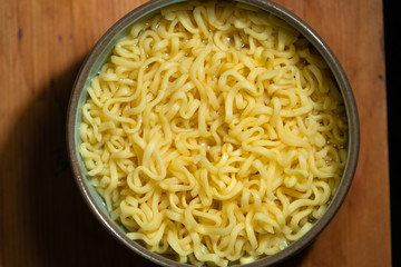 cup with instant noodles. yellow wheat noodles