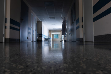 Light at the end of the corridor with gurney in the hospital - 301558717