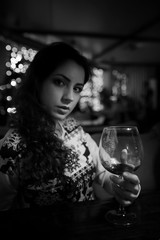 The girl in the evening in a cafe