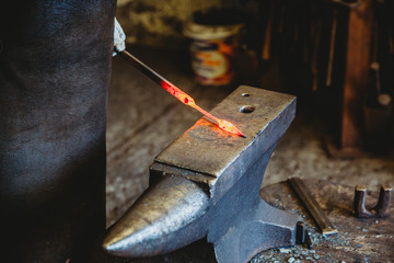 Blacksmith working in his workshop