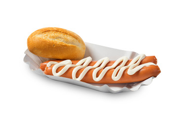 Bread roll and sausage with sauce. White background.