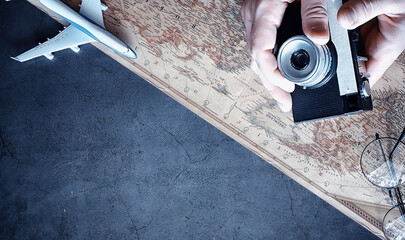 Travel concept. Map on the table andl aircraft.