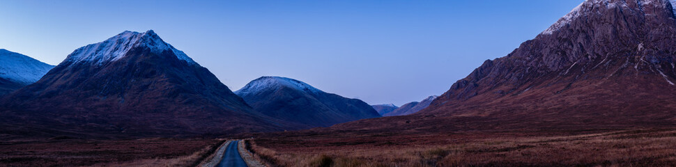 the night sky above buachaille etive mor and surrounding mountains of glencoe in the argyll region of the highlands of scotland during a clear dark sky night in autumn © Andy Morehouse