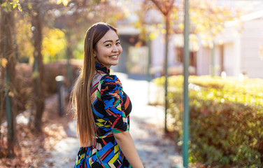 Attractive and happy young woman outdoors