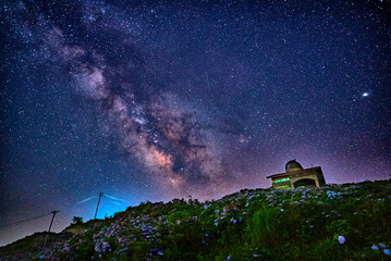 Milky way and the observatory on the flowery hill in Tokushima, Japan - obrazy, fototapety, plakaty