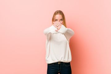 Young blonde teenager woman doing a denial gesture