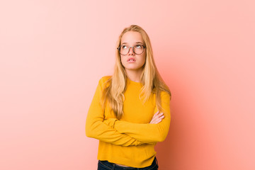 Adorable teenager woman tired of a repetitive task.