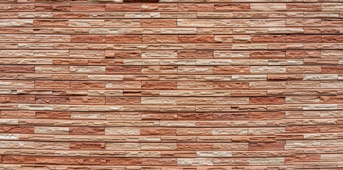 Pattern from lite brown decorative slate stone brick wall surface. panorama of brown stone wall...