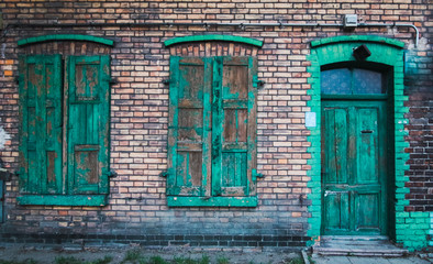 old wooden door in brick wall