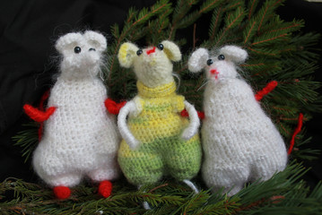 Three mice with spruce branches