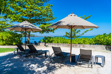 Umbrella and chair on the beach and sea with blue sky