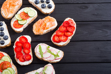 Variation of toast with fruit , vegetable and salmon