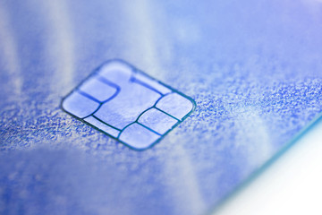 Electronic contactless credit card with selective focus microchip. Macro of a credit card.