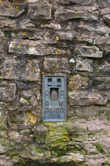 Ordnance Survey Iron Benchmark set in stonewall