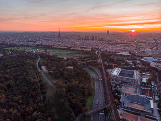 Aerial view of Paris skyline with Eiffel Tower from the Boulogne Forest at rising morning sun