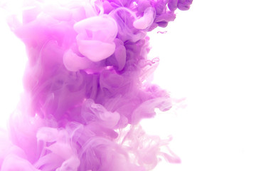 Abstract flowing liquid or violet ink in water on a white background. It looks like smoke or cloud....