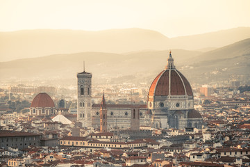 Pink and orange dawn over the city of Florence. Aquarelle toned sunrise. Travel destination Tuscany, Italy