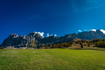 Panoramic view of the Rosengarten massif alpine mountains in the Schlern nature park area with the Messnerjoch hut in the background