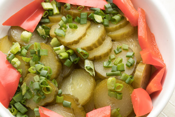 Ukrainian cuisine, Russian food, ethnic food, culinary delights, an appetizer with spices, pickles. Sliced ​​cucumbers in rings in a plate