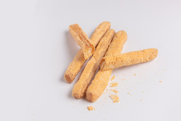 Crispy bread sticks with cheese  on white 