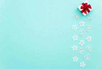 Christmas composition with gift, stars and snowflakes inside earth with green background. Christmas concept with copy space