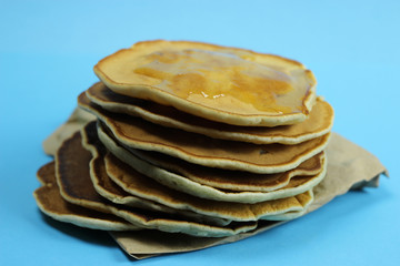 stack of pancakes on a blue background