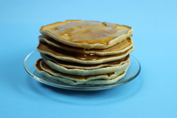 stack of pancakes on a blue background