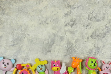 Fototapeta na wymiar frame of toys on a gray background