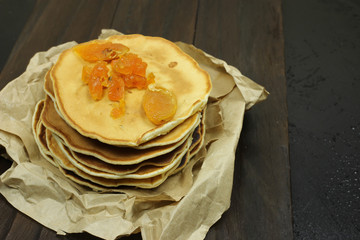 stack of pancakes on a black background