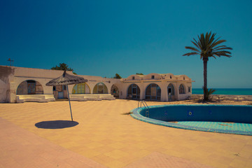 Landscape of a destroyed and abandoned resort in Djerba, Tunisia caused by independence.