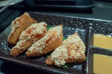 fried bread and shimp on a plate
