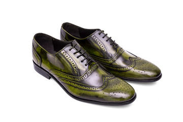 Pair of male black and yellow leather shoes on white background, isolated product, top view.